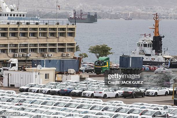 Military police escorts a truck carrying a container to a nearby navy base on March 9, 2014 at the southern Israeli port of Eilat, where Israeli army...