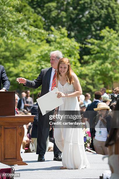 female student graduating at phillips exeter academy school graduation 2015 - phillips exeter academy stock pictures, royalty-free photos & images