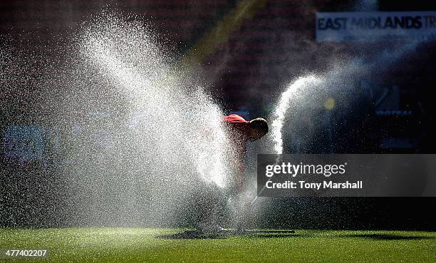 Groundman at Bramall Lane adjusting the water sprinkler on the pitch before the FA Cup Quarter-Final match at Bramall Lane on March 9, 2014 in...