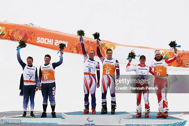 Silver medalists, Mark Bathum and his guide Cade Yamamoto of USA, gold medalists, Jakub Krako and his guide Martin Motyka of Slovakia, Bronze...