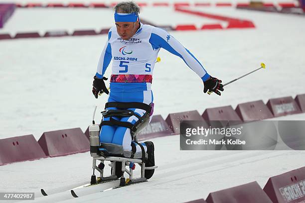 Roland Ruepp of Italy competes in the men's 15km sitting cross-country skiing during day two of Sochi 2014 Paralympic Winter Games at Laura...