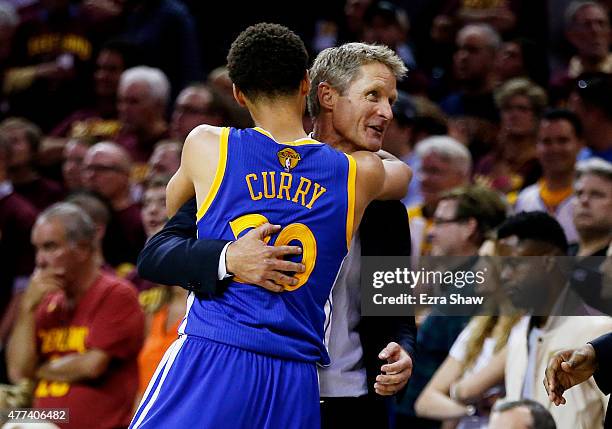 Stephen Curry of the Golden State Warriors celebrates with head coach Steve Kerr after they defeated the Cleveland Cavaliers 105 to 97 in Game Six of...