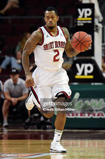 Paul McCoy of the Saint Mary's Gaels brings the ball up the court against the Pepperdine Waves during a quarterfinal game of the West Coast...