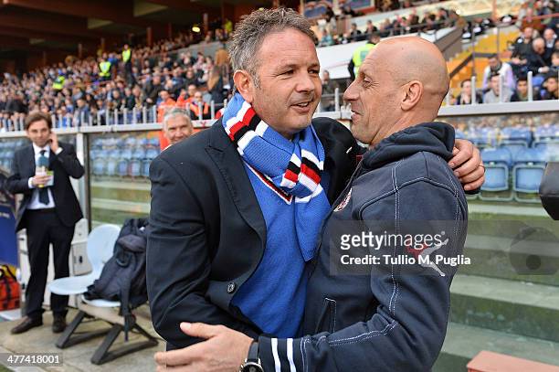 Coach Sinisa Mihajlovic of Sampdoria hugs Coach Domenico Di Carlo of Livorno during the Serie A match between UC Sampdoria and AS Livorno Calcio at...
