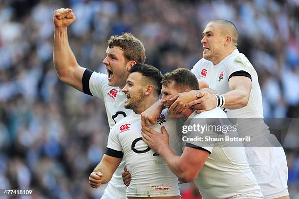 Danny Care of England celebrates with Joe Launchbury , Dylan Hartley and Mike Brown as he scores their first try during the RBS Six Nations match...