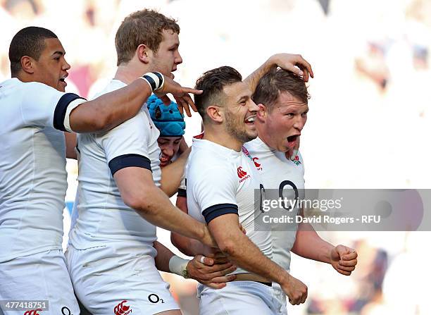 Danny Care of England celebrates with Dylan Hartley Joe Launchbury and Luther Burrell as he scores their first try during the RBS Six Nations match...