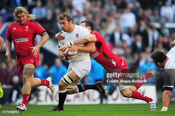 Chris Robshaw of England is tackled by Sam Warburton of Wales during the RBS Six Nations match between England and Wales at Twickenham Stadium on...