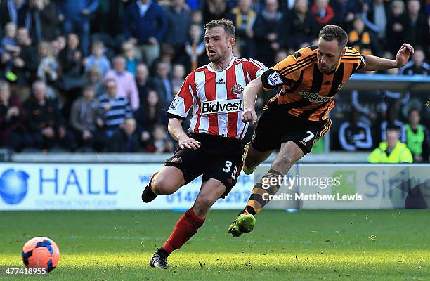 David Meyler of Hull City beats the tackle from Lee Cattermole of Sunderland to score his teams second goal during the FA Cup Quarter Final match...