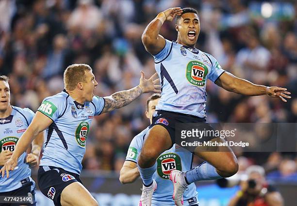 Michael Jennings of the Blues celebrates scoring a try during game two of the State of Origin series between the New South Wales Blues and the...
