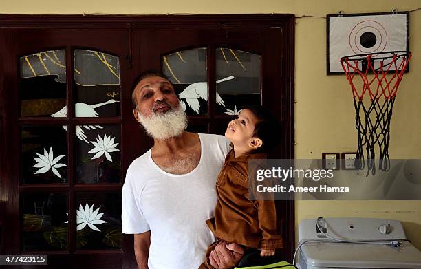 grandfather and boy - pakistan family stock pictures, royalty-free photos & images