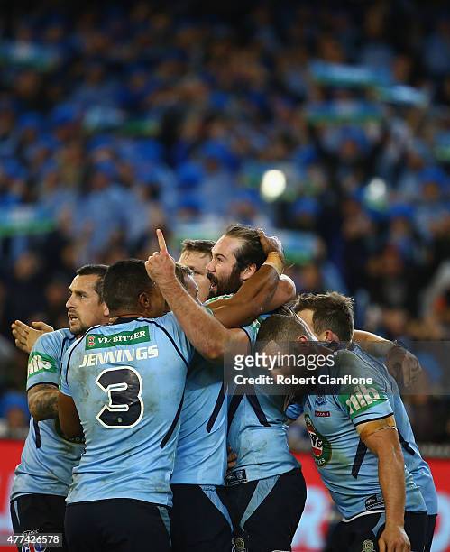 Aaron Woods of the Blues celebrates with team mates after scoring a try during game two of the State of Origin series between the New South Wales...