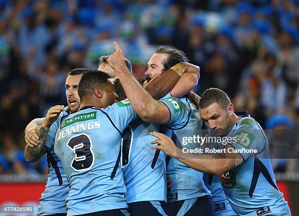 Aaron Woods of the Blues celebrates with team mates after scoring a try during game two of the State of Origin series between the New South Wales...