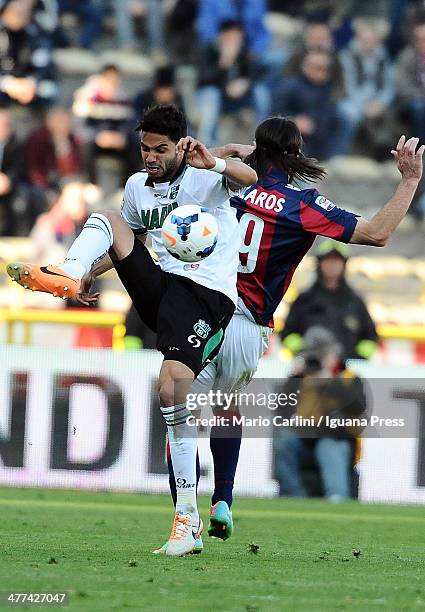 Pedro Mendes of US Sassuolo Calcio competes the ball with Lazaros of Bologna FC during the Serie A match between Bologna FC and US Sassuolo Calcio at...