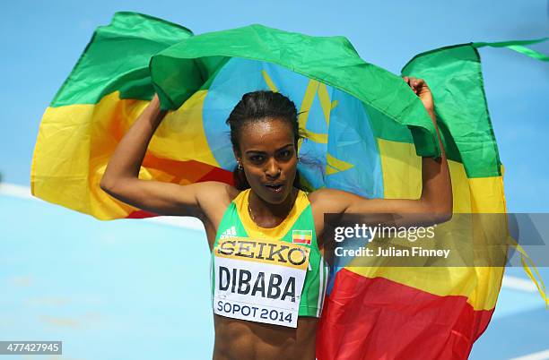 Genzebe Dibaba of Ethiopia celebrates winning the gold medal in the Women's 3000m final during day three of the IAAF World Indoor Championships at...