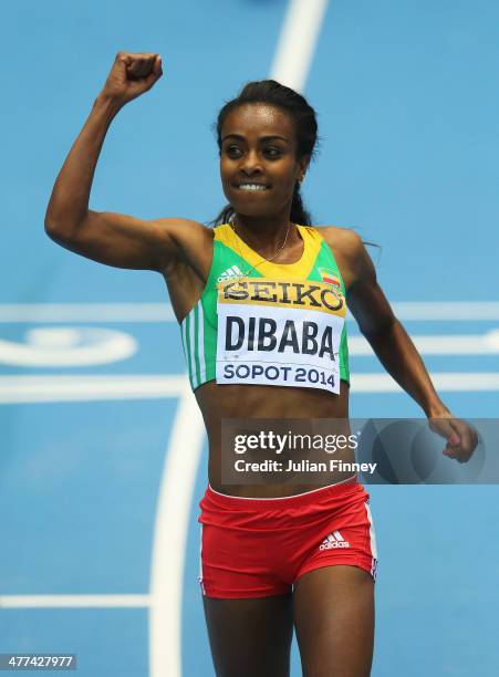 Genzebe Dibaba of Ethiopia celebrates winning the gold medal in the Women's 3000m final during day three of the IAAF World Indoor Championships at...