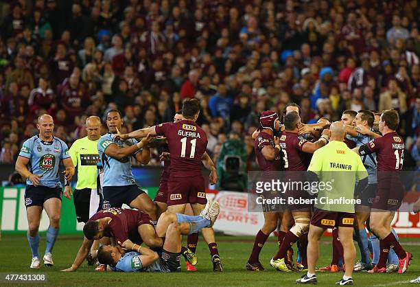 Players from both teams scuffle during game two of the State of Origin series between the New South Wales Blues and the Queensland Maroons at the...