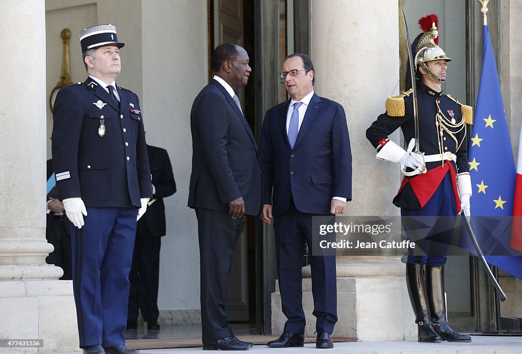 French President Francois Hollande Receives Ivory Coast President Alassane Ouattara At Elysee Palace