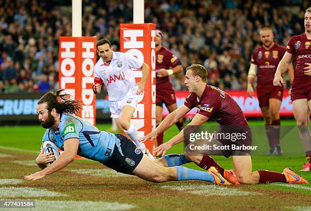Aaron Woods of the Blues scores a try during game two of the State of Origin series between the New South Wales Blues and the Queensland Maroons at...