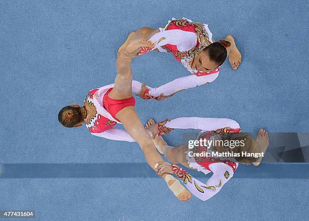 Valeriia Belkina, Yulia Nikitina and Zhanna Parkhometc of Russia compete in the Gymnastics Acrobatic Women's Group Dynamic Qualification during day...