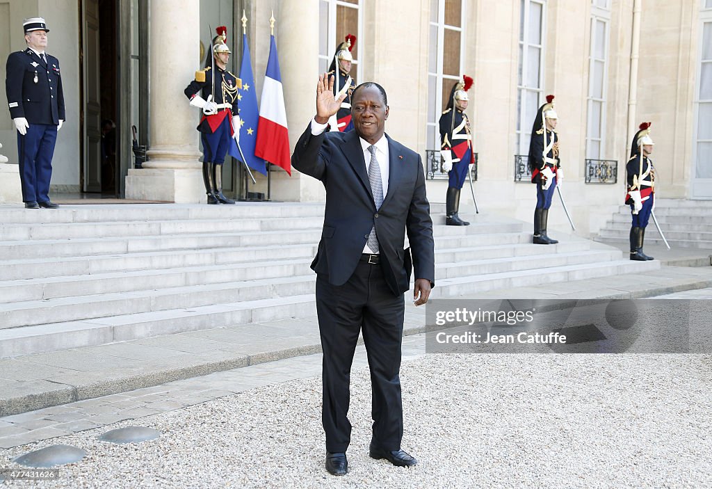 French President Francois Hollande Receives Ivory Coast President Alassane Ouattara At Elysee Palace
