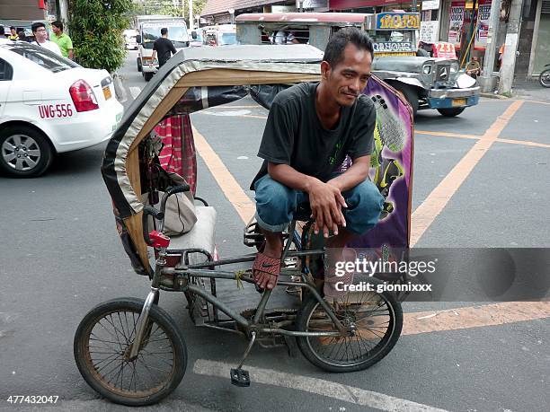 manila pedicab driver, philippines - filipino tricycle stock pictures, royalty-free photos & images