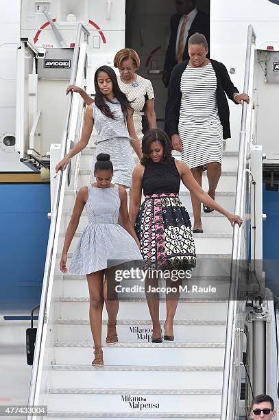 First Lady Michelle Obama arrives with daughters Malia Obama and Sasha Obama and her mother Marian Robinson at Malpensa Airport on June 17, 2015 in...