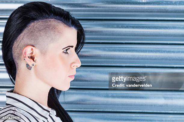 woman with a part-shaved head and tattoos - half shaved hairstyle stock pictures, royalty-free photos & images