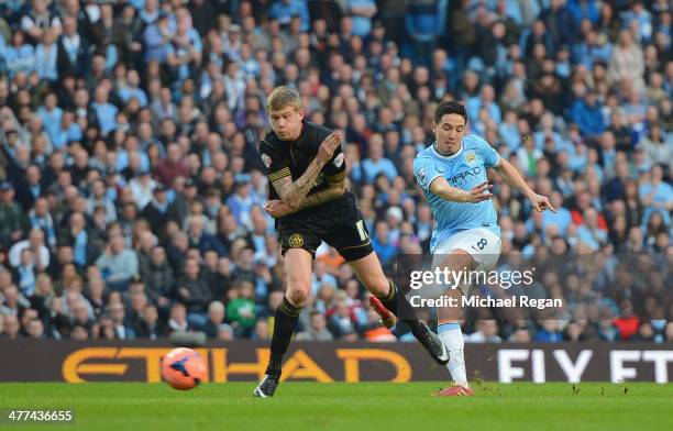 Samir Nasri on Man City scores to make it 2-1 during the FA Cup Quarter-Final match between Manchester City and Wigan Athletic at the Etihad Stadium...