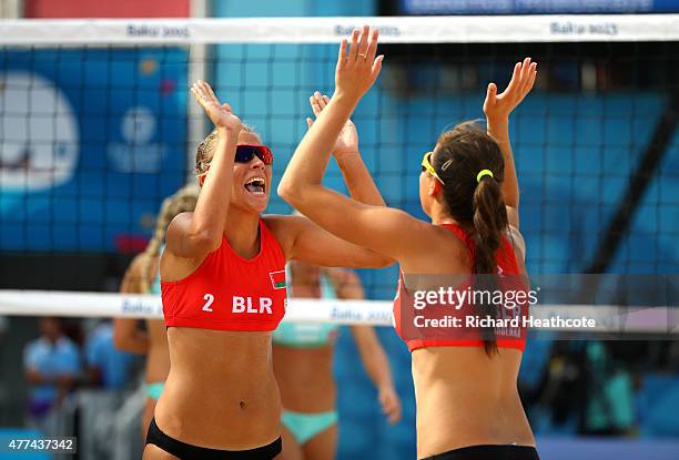 Yana Mileuskaya and Valeryia Babenka of Belarus celebrate during the Women's Beach Volleyball Preliminary round match against Norway on day five of...