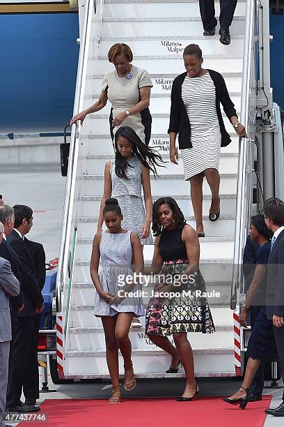 First Lady Michelle Obama arrives with daughters Malia Obama and Sasha Obama and her mother Marian Robinson at Malpensa Airport on June 17, 2015 in...