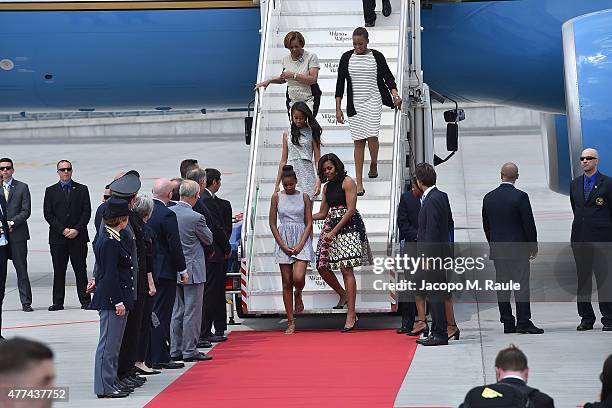 First Lady Michelle Obama arrives with daughters Malia Obama and Sasha Obama and her mother Marian Robinson at Malpensa Airport on June 17, 2015 in...