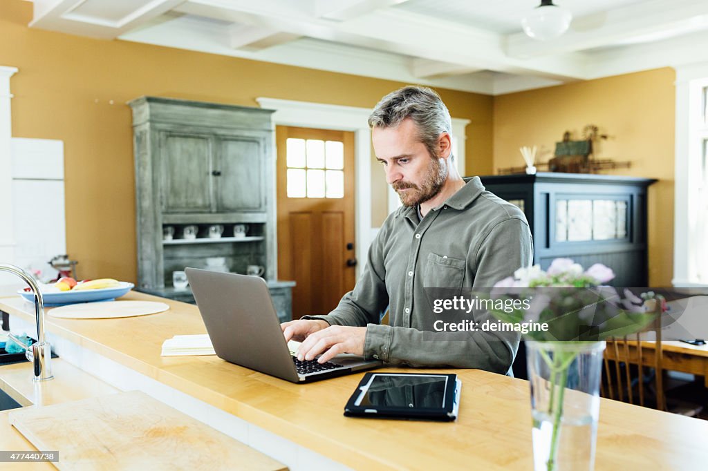 Man using laptop at home