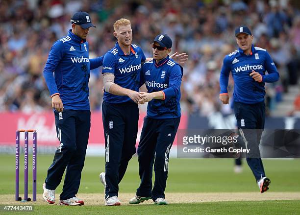 Ben Stokes of England celebrates with Alex Hales and England captain Eoin Morgan after dismissing Martin Guptill of New Zealand during the 4th ODI...