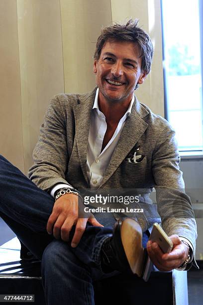 Actor Roberto Farnesi takes a photo of his shoes at Cuoio di Toscana during the Pitti Uomo 88 at Fortezza da Basso on June 16, 2015 in Florence,...