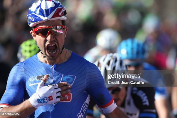Nacer Bouhanni of France and Team FDJ wins the sprint finish and wears the first leader's yellow jersey after Stage 1 of the Paris-Nice 2014 race on...