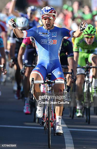 Nacer Bouhanni of France and Team FDJ wins the sprint finish and wears the first leader's yellow jersey after Stage 1 of the Paris-Nice 2014 race on...