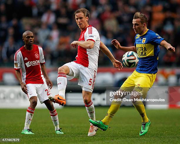 Christian Poulsen of Ajax clears the ball away from Marcel Ritzmaier of Cambuur during the Eredivisie match between Ajax Amsterdam and SC Cambuur...