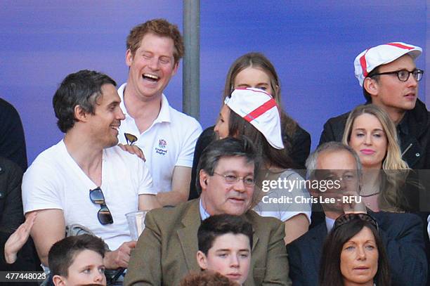 Prince Harry and Cressida Bonas look on during the RBS Six Nations match between England and Wales at Twickenham Stadium on March 9, 2014 in London,...