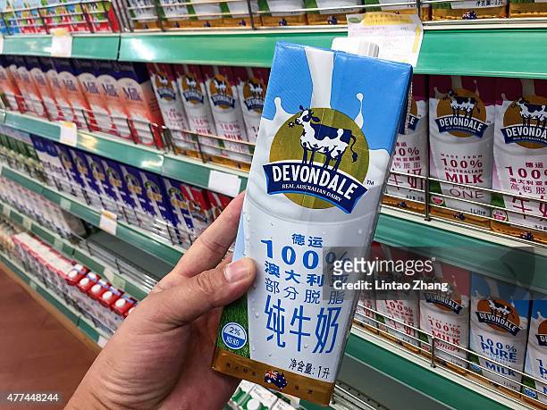 Milk imported from Australia are displayed for sale at supermarkets on June 17, 2015 in Beijing, China. China's Minister of Commerce Gao Hucheng...