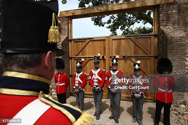 Soldiers from the Coldstream Guards dressed in period costume take part in the ceremonial closing of the North Gate of Hougoumont Farm, originally...