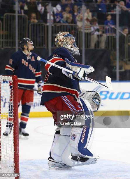Henrik Lundqvist of the New York Rangers celebrates at the end of the game against the Detroit Red Wings at Madison Square Garden on March 9, 2014 in...