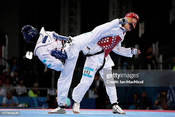 Mario Silva of Portugal competes with Servet Tazegul of Turkey during the repechage round of the Men's 68kg during day five of the Baku 2015 European...