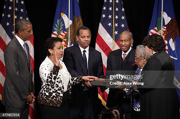 Attorney General Loretta Lynch participates in a formal investiture ceremony, administered by Supreme Court Justice Sonia Sotomayor , as her husband...