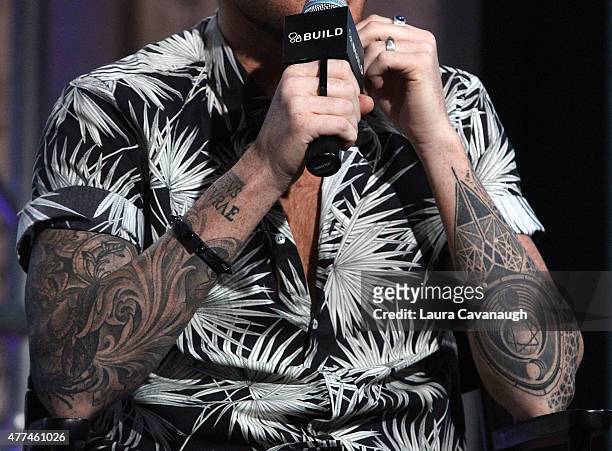 Adam Lambert, tattoo and jewelry detail, attends AOL Build Speaker... News  Photo - Getty Images