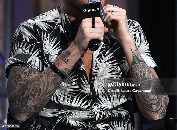 Adam Lambert, tattoo and jewelry detail, attends AOL Build Speaker... News Photo - Getty Images Adam Lambert, tattoo and jewelry detail, attends AOL Build Speaker... News Photo - Getty Images