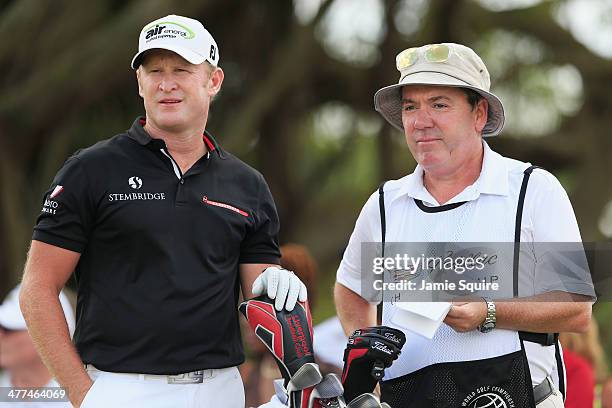 Jamie Donaldson of Wales waits with his caddie Mick Donaghy on the fifth tee during the final round of the World Golf Championships-Cadillac...