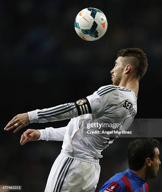 Sergio Ramos of Real Madrid heads the ball during the La Liga match between Real Madrid and Levante UD at Estadio Santiago Bernabeu on March 9, 2014...