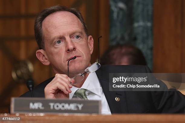 Senate Budget Committee member Sen. Pat Toomey listens to testimony from Congressional Budget Office Director Keith Hall during a hearing in the...