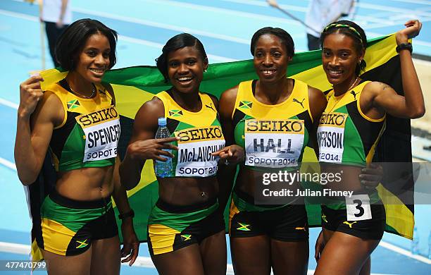 Silver medalists Kaliese Spencer, Anneisha McLaughlin, Patricia Hall and Stephenie Ann McPherson of Jamaica pose after the Women's 4x400m relay final...