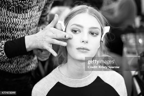 Model prepares backstage prior to the Viktor&Rolf show as part of Paris Fashion Week Womenswear Fall/Winter 2014-2015 on March 1, 2014 in Paris,...